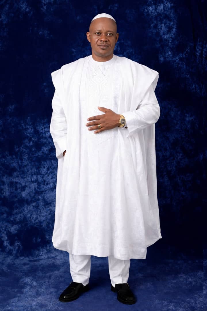 Pastor Goodluck in traditional white attire